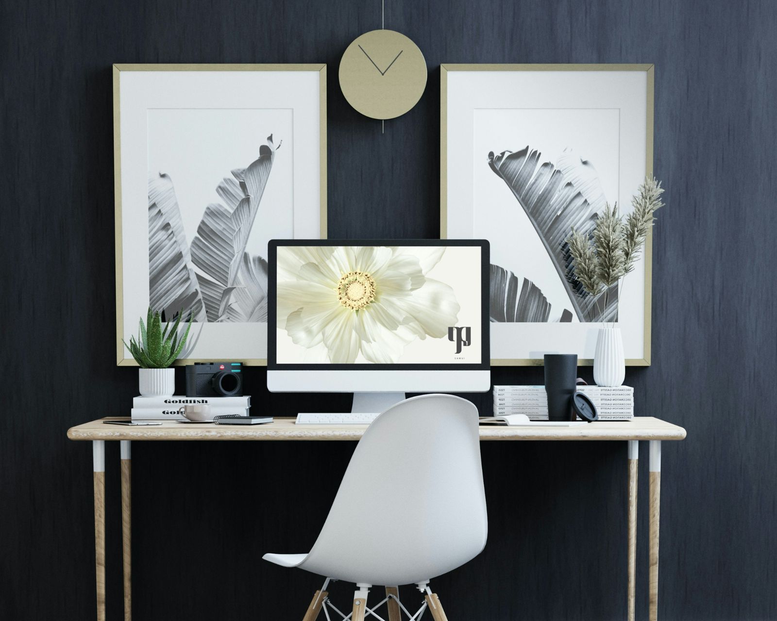 Villa Ledu identity on a desktop screen and framed prints